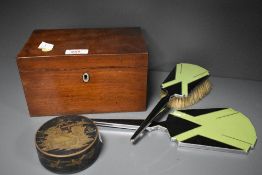 An antique wooden tea caddy,art deco dressing table mirror and brush set,and metal trinket box