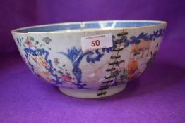 An antique Chinese porcelain punch bowl having antique repairs