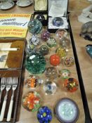 A collection of paperweights including Caithness.