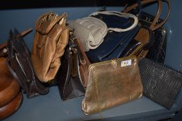 A mixed lot of vintage handbags, varied colours and sizes, many with frames and clasp fastenings.