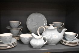 A part tea service by Royal Doulton in the Forest Glade design having a duck egg blue on white glaze
