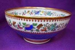 A punch or fruit bowl by Spode Copeland having exotic bird decoration