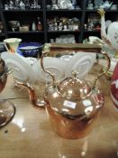 A large vintage copper kettle.