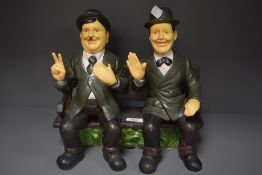 A ceramic Laurel and hardy ornament.