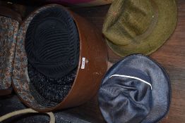 A hat case containing assorted vintage hats, 1940s to late 60s/early 70s.