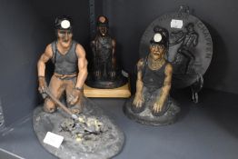 Three figures of coal miners by Morgan Vaughan and a similar disc plaque