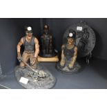 Three figures of coal miners by Morgan Vaughan and a similar disc plaque