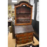 A 19th century specimen or apprentice piece in the form of a bureau bookcase, using a variety of