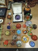 A large collection of paper weights including Caitness.