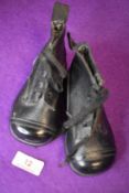 A pair of vintage 20s/30s leather childrens boots, appear to be unworn.