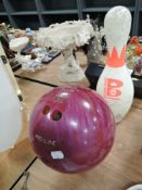 A vintage Pro Line bowling ball in pink and a matching pin