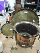 A vintage copper planter and two Indian or similar embossed brass trays.