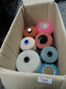A selection of large cotton or wool reels for textile or weaving work