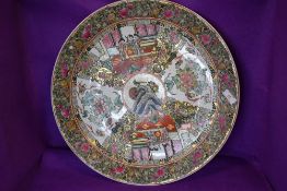 A large hand decorated Cantonese charger having character mark to back.