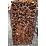 A richly carved wooden three dimensional Eastern wall hanging, extensive detail throughout.