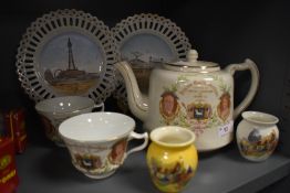 A tea pot and two tea cups for the Preston merchants guild and two Blackpool souvenir plates