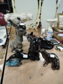 A collection of animal figurines including Poole dolphin and Sylvac cat.
