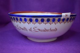An antique porcelain punch or wash bowl hand decorated and marked for Sunderland