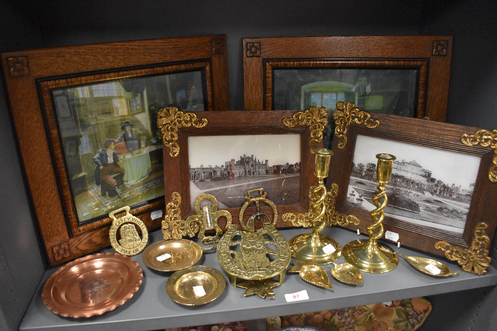 A selection of brass wares including candle sticks and matching picture frames