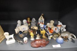 A selection of figures and figurines including pug dog and Stoffordshire style figures