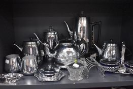 A selection of stainless steel kitchen wares including tea set and kettle