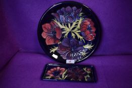 Two 1990s pieces of Moorcroft having Anemone pattern to cobalt blue ground, one being a