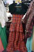A vintage 1950s tartan evening gown with tiered skirt and matching bolero.