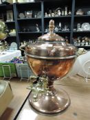 An antique copper and brass samovar.