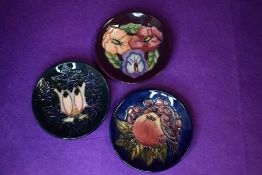 Three modern pin dishes by Moorcroft including plum green and blue glazes