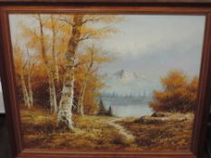 An oil painting on board, G Whitman, autumnal lake and mountain landscape, signed, 50 x 60cm plus