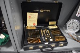 A cased Bestecke Sollingen 23/24ct. gold plated cutlery set.