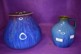 A Lovatt's Langley ware vase having blue and purple glaze and a Danseby ware Denby handled vase.