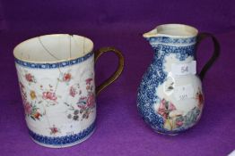 A Chinese or oriental jug with metal handle and mug with reed bound metal handle,both having hand