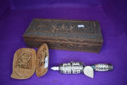 A vintage Tibetan prayer wheel, carved box and similar Tibetan carved deity's.