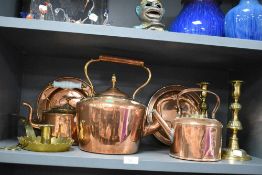 A good assortment of vintage and antique copper and brass ware including large kettle, candle