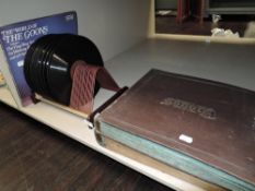 Two bound 78rpm shellac record sets and a vinyl record rack