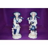 A pair of porcelain figure studies of fishermen