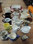 A selection of milk cream and water jugs including Masons