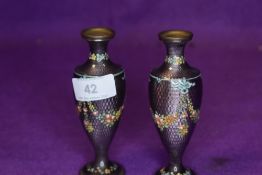 A pair of early 20th century purple guilloche vases having emamel swag and floral design.