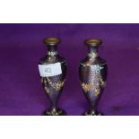 A pair of early 20th century purple guilloche vases having emamel swag and floral design.