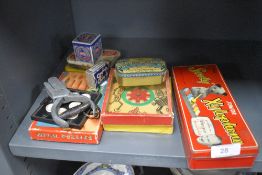 A mixed lot of vintage games, a ticket punch and advertising tins including a Sooty Xylophone in