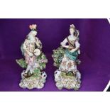 A pair of antique musician figurines,around 19th century, including gent in period clothing with