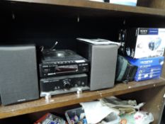 A Hitachi CD player with speakers, a Sony camcorder, a Olympus digital camera and more.