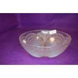 An art deco Rene Lalique opalescent coquille bowl having overlapping shells.