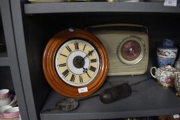 A vintage clock and a Bush radio.