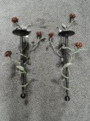 Two wrought iron wall mounted candle brackets or sconce