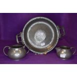 A Tudric pewter tazza or footed bowl having Art Nouveau styling and a Talbot pewter sugar basin