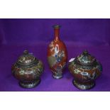 Two Cloisonné lidded pots with butterflies,birds and vines and a intricately detailed vase having