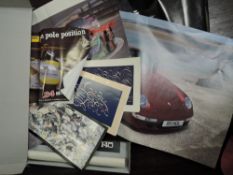 A box full of posters of sports ,formula one and other mixed interest.