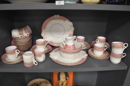 A Victorian tea service including cups and saucers,plates,jug and more with brown transfer motif,